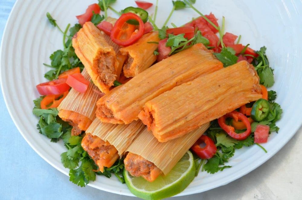 Our freshly steamed pork tamales. Yelp