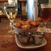 Farmhouse - Chicago, IL, United States. Drinks and cheese curds at the bar