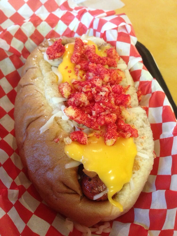 Mozzarella cheese, nacho cheese with flaming hot Cheetos all on a bacon