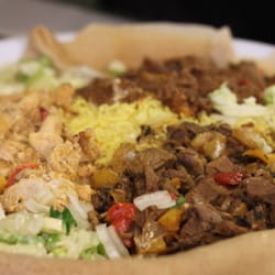 Afro-Canadian Restaurant - Vancouver, BC, Canada. Meat combo: chicken, beef, lamb