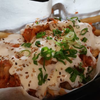 Del Seoul - Chicago, IL, United States. kimchee pork belly fries with crema