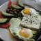 Two eggs, oven-baked sunny-side up with sautéed organic spinach and a slice of French feta cheese. Served with sliced tomatoes, cucumbers and Mediterranean olives  as beautiful as it is delicious.