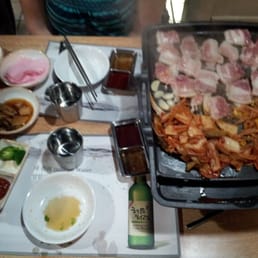 Oh! My SamGyupSal - Duluth, GA, United States. The whole spread while our garlic pork belly and kimchi are being cooked.
