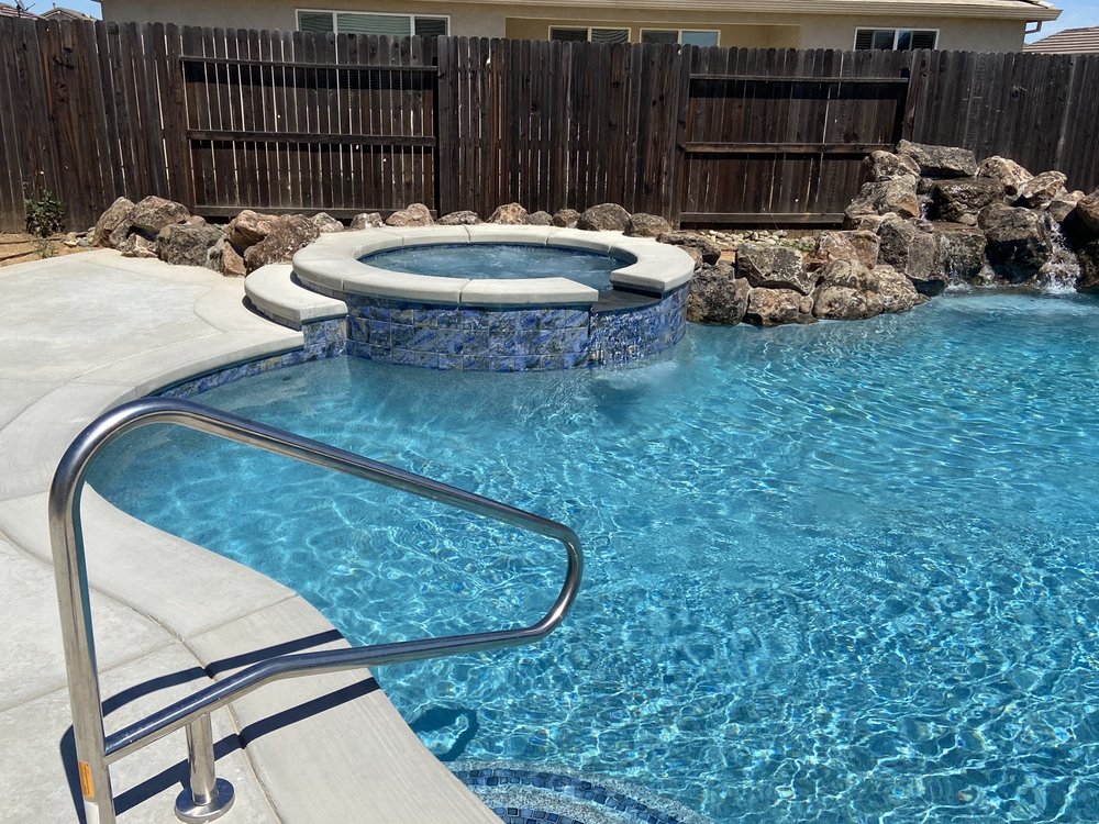 Tropical Paradise Pools Spas & Backyards