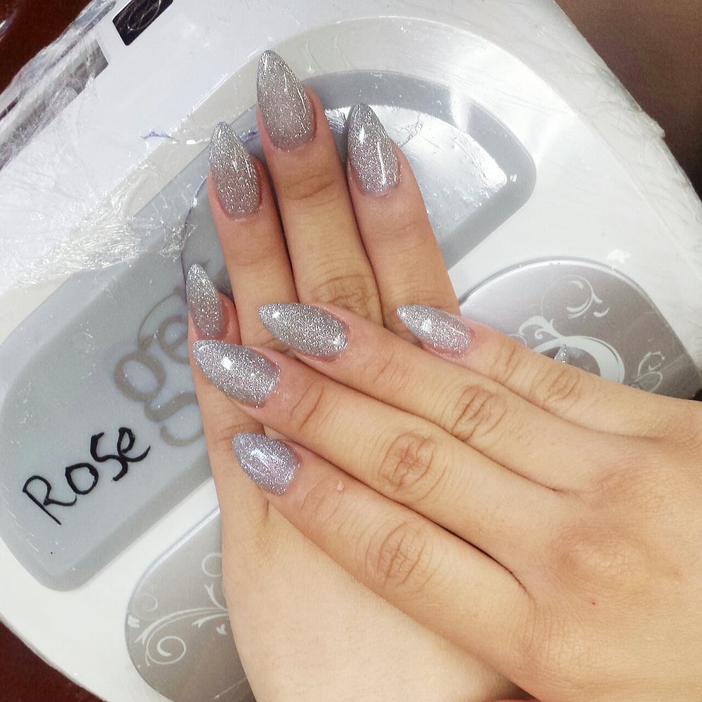 Acrylic Stiletto Nails W Silver Glitter Gel Polish Done By Rose Photo Of Bella Vous Nails Spa Rancho Cucamonga Ca United States Acrylic