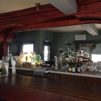 Beautiful Columned Woodwork And Mirror Behind The Bar Yelp