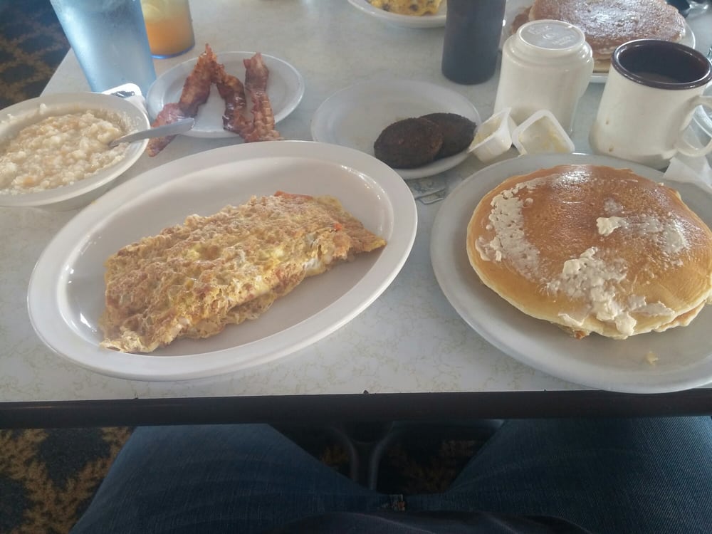 . Cheese grits sausage bacon pancakes and the corned beef hash omelette. - Yelp
