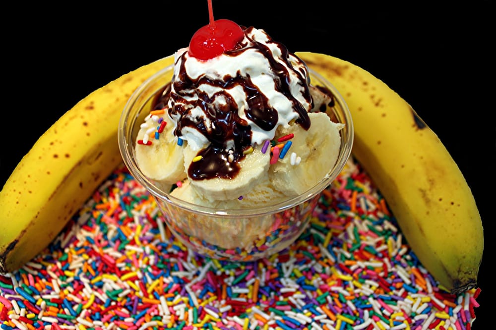 Banana Sundae Ice Cream topped with Bananas, sprinkles, whipped cream