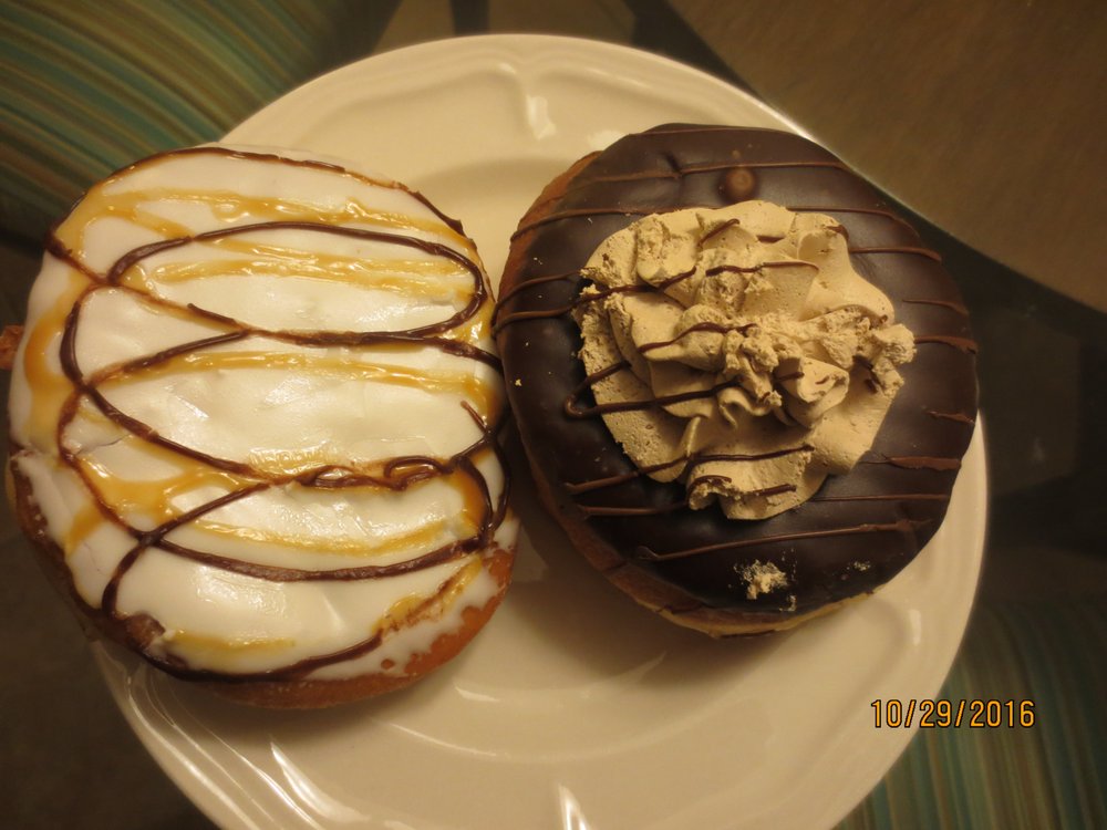 Photo of Pink Box Doughnuts - Henderson, NV, United States. caramel cheesecake (L) and mocha (R)