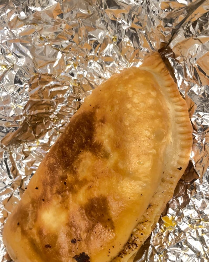 Empanada Haitiana Aquí