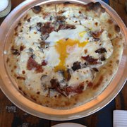 Pulino's - New York, NY, United States. Funghi pizza: pancetta, mushroom, cracked egg, and cheese