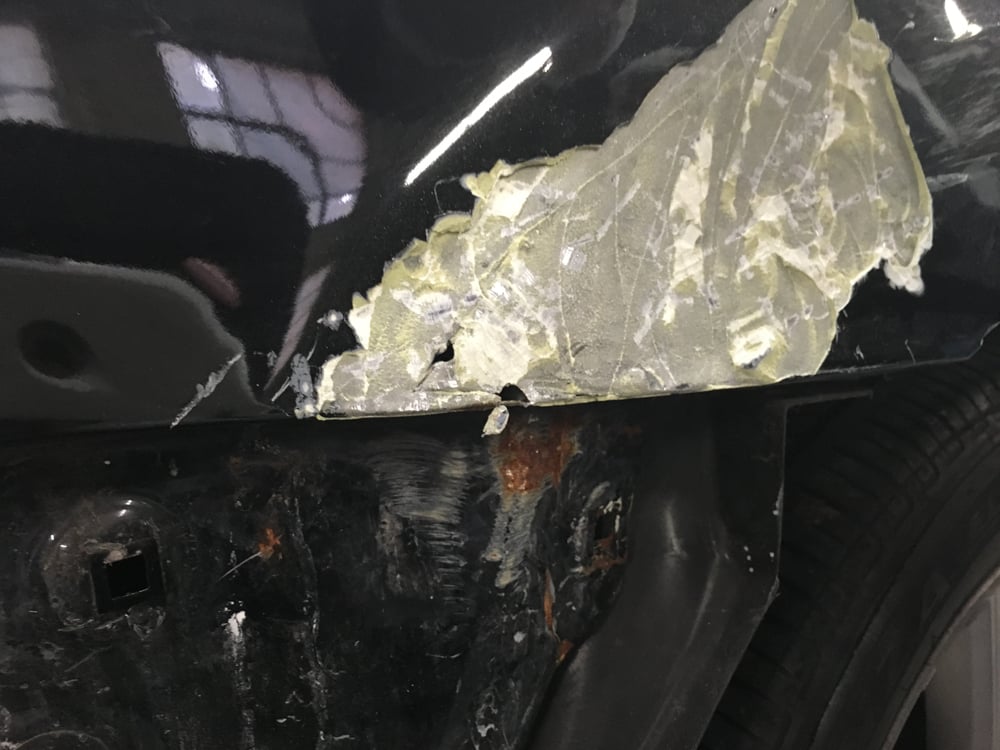 Almost a half inch of bondo on rear quarter panel, and ...