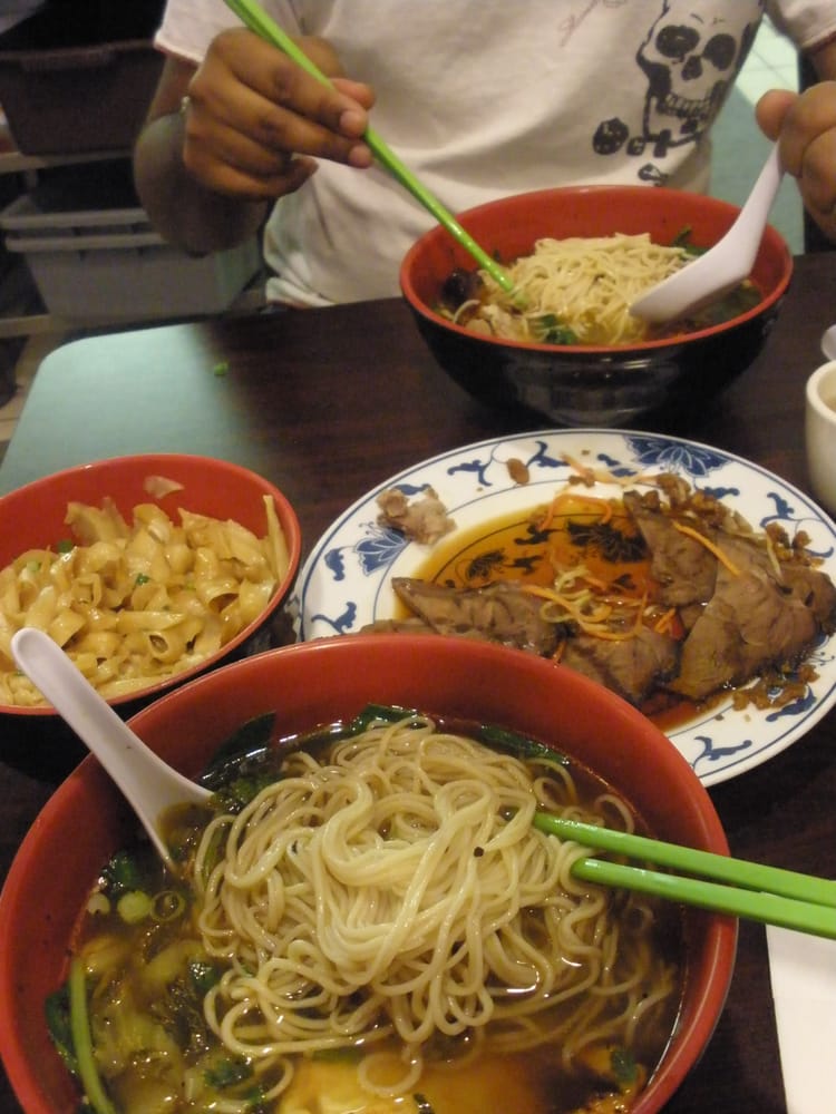 Vegetable and egg soup, duck soup, peanut noodles, and marinated beef