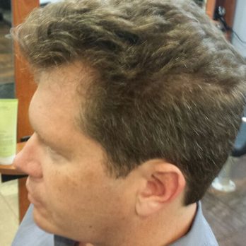 Mens hc has natural curly hair cut and Blowdry with Aveda be