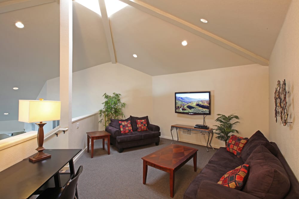 Our Clubhouse Loft Vaulted Ceilings Cozy Seating Desks And A Huge Photo Of Glacier Point Apartments Davis Ca United States Our Clubhouse Loft