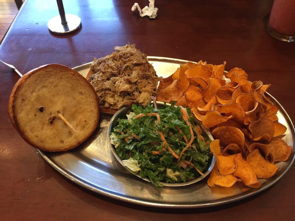 Pulled BBQ chicken sandwich on gluten free bun w sweet potato chips and
