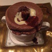 Chocolate soufflé with duo of sauces