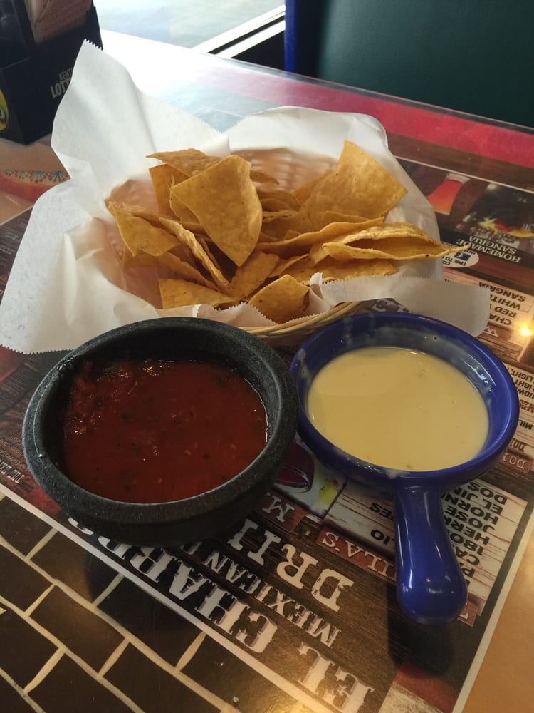 Tasty chips, Salsa, and Queso cheese dip. Yelp