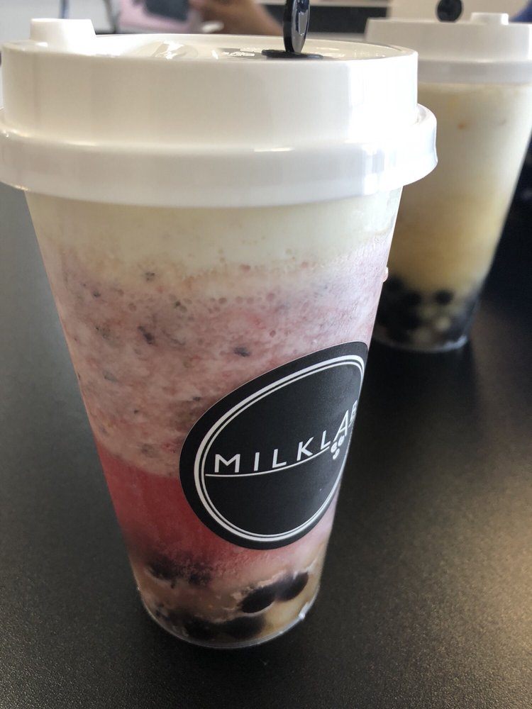 Strawberry oolong tea with milk cap and boba. - Yelp