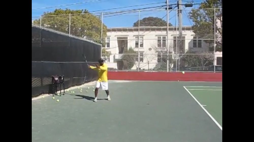 Photo of Tennis Lessons By Mcclain - San Francisco, CA, United States. Notice how the racket is back early, and I'm in perfect position to hit the ball, left hand is out for balance