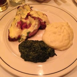 Photo of The Post House - New York, NY, United States. Steak with creamed spinach and mached potatoes
