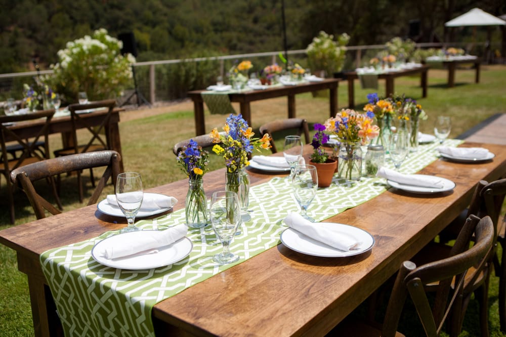 Farm tables, crossback chairs, avacado lattice table runners, and