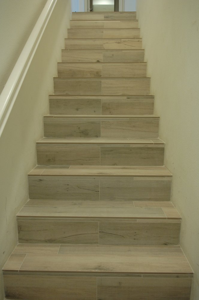 12 X 24 Porcelain Tile From Lowe S On A Fireplace In Woodland 12 X 24 Porcelain Tile From Lowe S On A Fireplace In Woodland Hills Schluter Profiles Trim Around Opening Of And Wall Edge Yelp