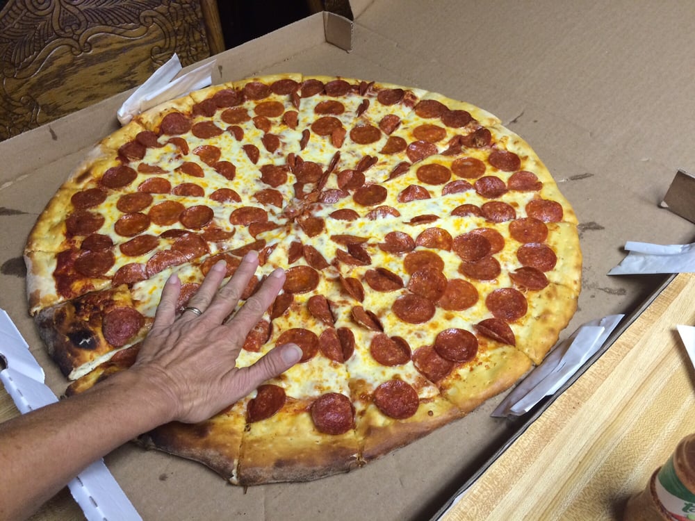 family size pizza moms hand for comparison yelp pizza size comparison